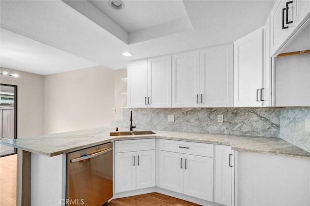 401 Deerfield Ave Unit 84, Irvine, CA 92606 - kitchen featuring dishwasher, a sink, open shelves, white cabinets, and a peninsula