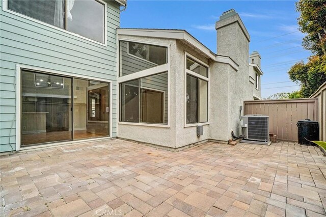 401 Deerfield Ave Unit 84, Irvine, CA 92606 - view of patio / terrace with central air condition unit and fence