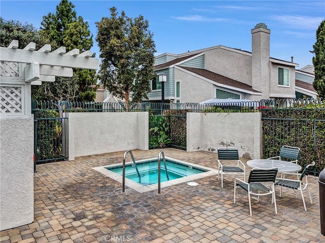 401 Deerfield Ave Unit 84, Irvine, CA 92606 - view of swimming pool with a community hot tub, fence, and a patio