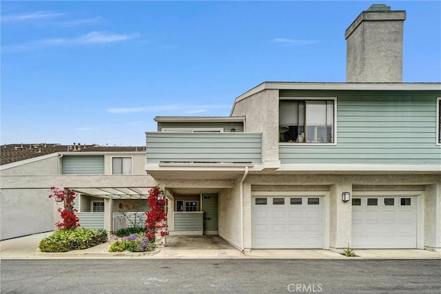 401 Deerfield Ave Unit 84, Irvine, CA 92606 - multi unit property with an attached garage, stucco siding, and a chimney