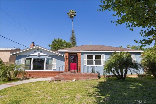 8321 Quartz Ave, Winnetka, CA 91306 - bungalow-style house featuring brick siding and a front yard