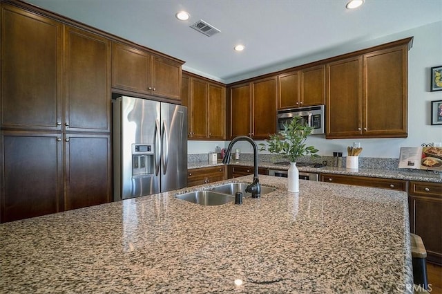 32804 Red Carriage Rd, Winchester, CA 92596 - kitchen featuring appliances with stainless steel finishes, a sink, dark stone countertops, and recessed lighting