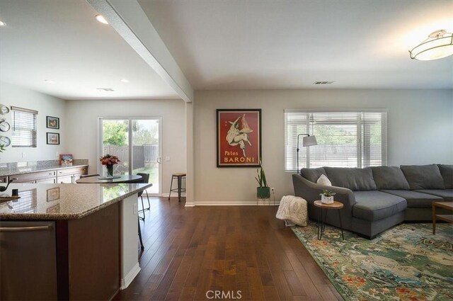 32804 Red Carriage Rd, Winchester, CA 92596 - living area with dark wood-type flooring, baseboards, and recessed lighting