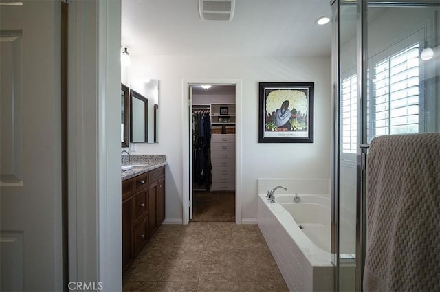 32804 Red Carriage Rd, Winchester, CA 92596 - full bathroom with vanity, a garden tub, a walk in closet, and a shower stall