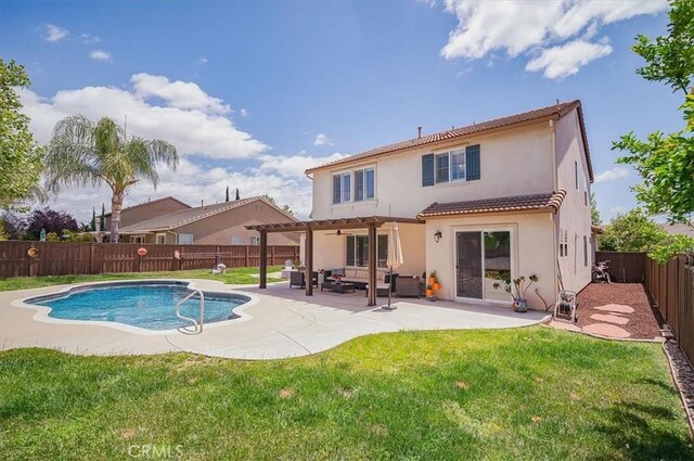 32804 Red Carriage Rd, Winchester, CA 92596 - back of property featuring a pergola, outdoor lounge area, stucco siding, a patio area, and a tiled roof