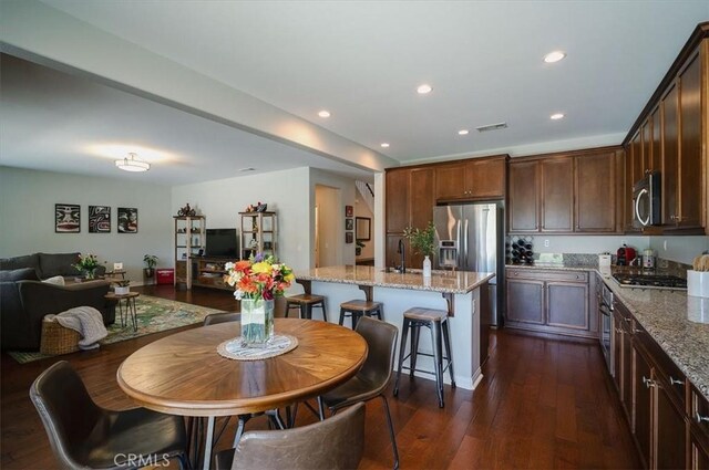 32804 Red Carriage Rd, Winchester, CA 92596 - dining area with dark wood finished floors and recessed lighting