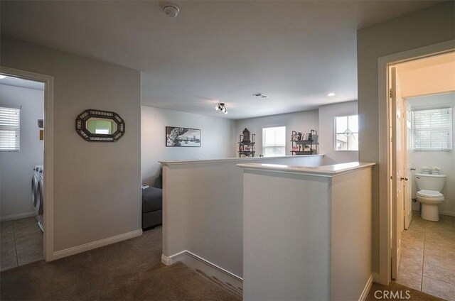 32804 Red Carriage Rd, Winchester, CA 92596 - hallway with an upstairs landing, baseboards, and tile patterned flooring