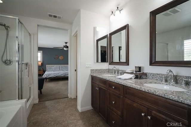 32804 Red Carriage Rd, Winchester, CA 92596 - ensuite bathroom featuring double vanity, a shower stall, a ceiling fan, tile patterned flooring, and baseboards