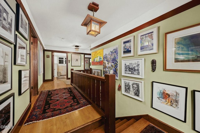 657 Prospect Blvd, Pasadena, CA 91103 - hall with an upstairs landing, wood finished floors, and baseboards