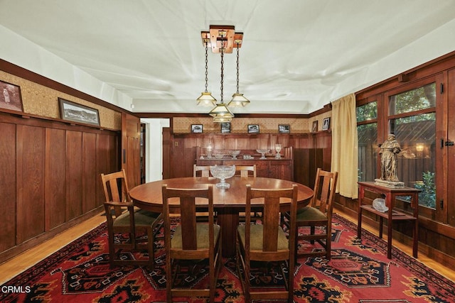 657 Prospect Blvd, Pasadena, CA 91103 - dining space with light wood-style flooring and wood walls