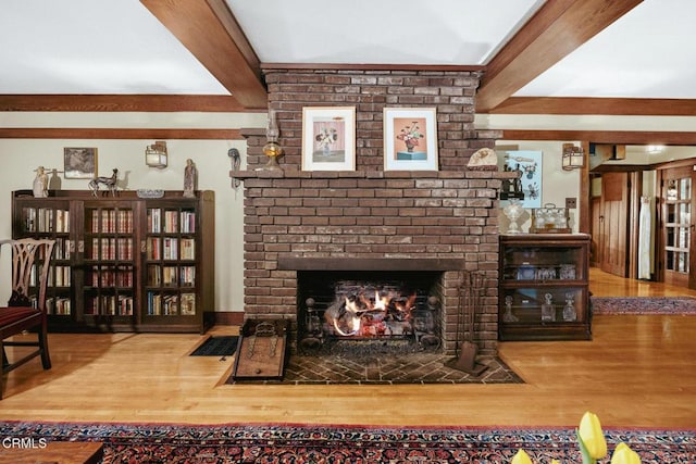 657 Prospect Blvd, Pasadena, CA 91103 - living room with beam ceiling, wood finished floors, and a brick fireplace