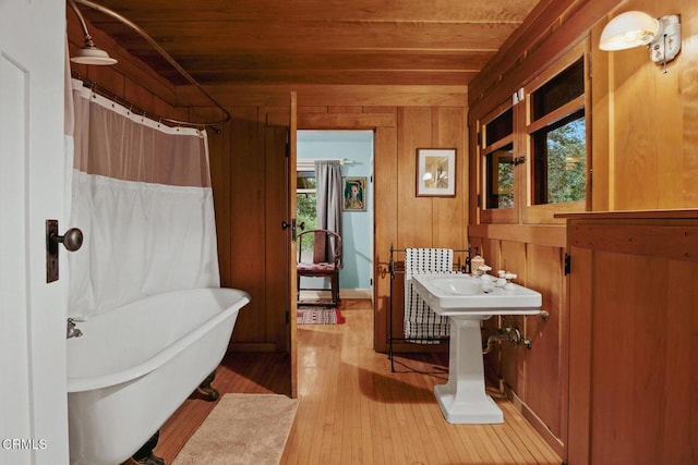 657 Prospect Blvd, Pasadena, CA 91103 - full bath featuring wooden ceiling, a freestanding bath, hardwood / wood-style floors, wood walls, and healthy amount of natural light
