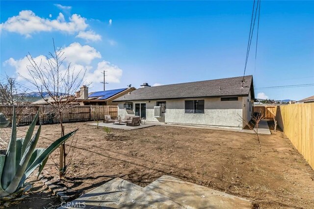 38532 Division St, Palmdale, CA 93550 - rear view of property featuring a patio area, stucco siding, and a fenced backyard
