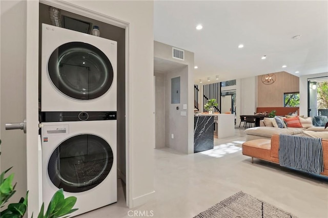 700 Main St Unit 4, Venice, CA 90291 - washroom featuring stacked washer and clothes dryer, recessed lighting, a chandelier, and electric panel