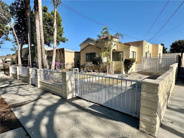1516 W Burnett St, Long Beach, CA 90810 - view of front of home featuring stucco siding, a gate, and a fenced front yard