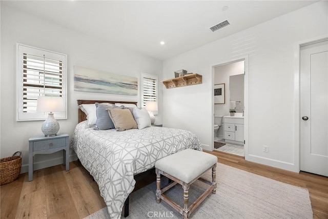 214 Canterbury, Irvine, CA 92618 - bedroom featuring wood finished floors, recessed lighting, baseboards, and ensuite bath
