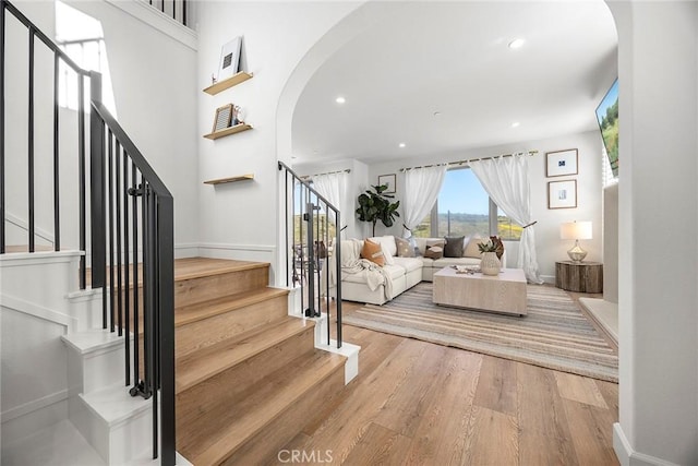 214 Canterbury, Irvine, CA 92618 - stairway with arched walkways, wood finished floors, baseboards, and recessed lighting