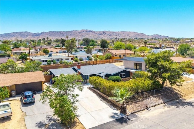 aerial view of residential area with a mountain backdrop