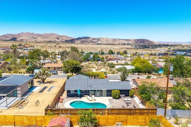 aerial view of residential area featuring a mountainous background