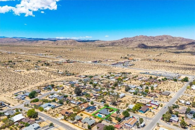 drone / aerial view of mountains and a desert landscape
