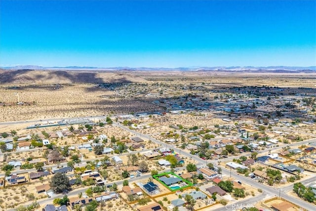 drone / aerial view of mountains and a desert landscape