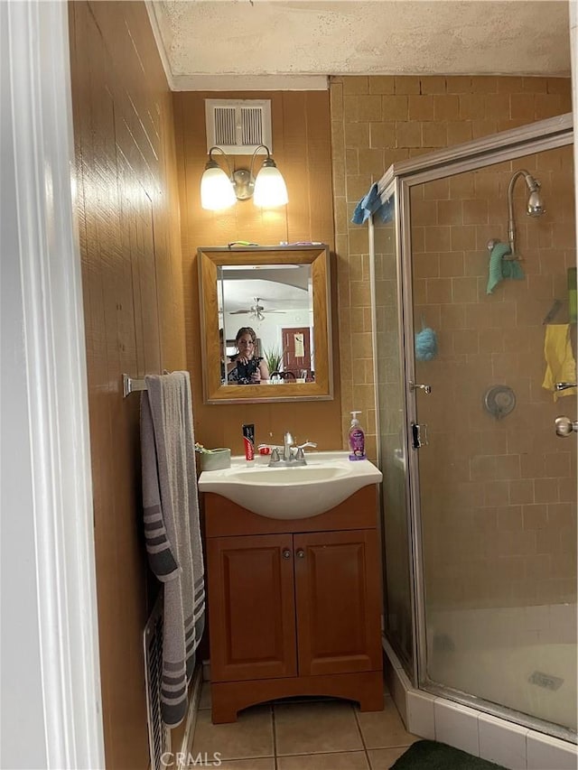 903 Lacon Ave, La Puente, CA 91744 - bathroom featuring a shower stall, vanity, tile patterned floors, and a textured ceiling