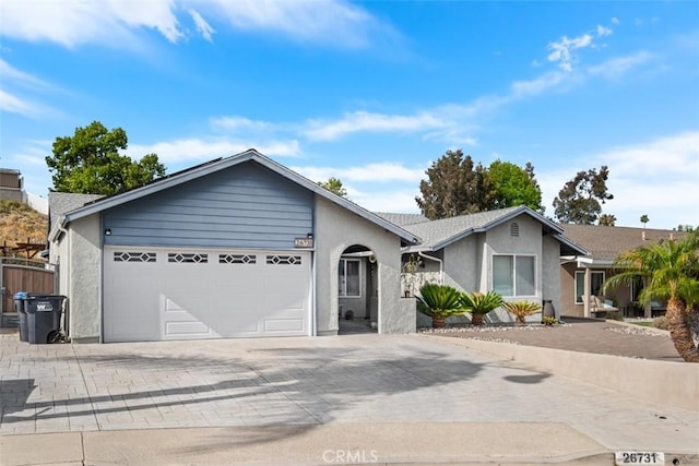 26731 Sinforosa Dr, Mission Viejo, CA 92691 - ranch-style house with decorative driveway, a garage, and stucco siding