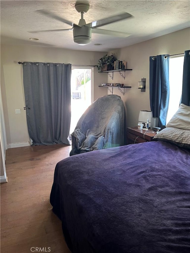 26731 Sinforosa Dr, Mission Viejo, CA 92691 - bedroom featuring wood finished floors, a ceiling fan, a textured ceiling, and baseboards