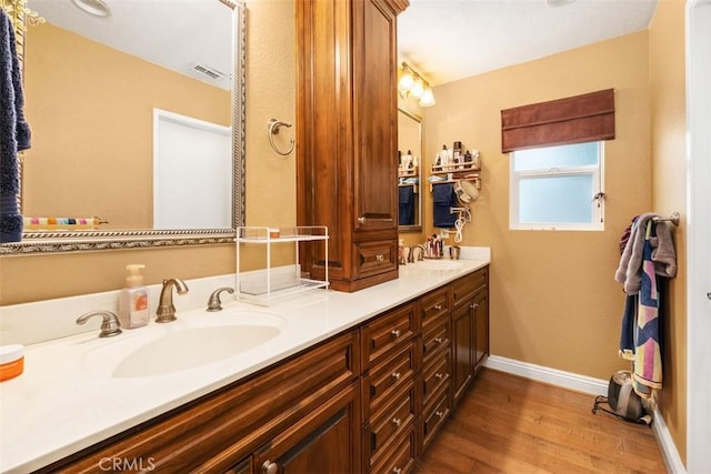 26731 Sinforosa Dr, Mission Viejo, CA 92691 - bathroom with wood finished floors, baseboards, and double vanity