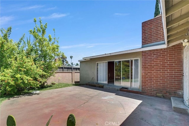 view of patio / terrace with fence