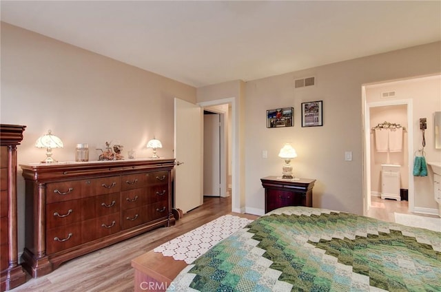 8646 Butte Cir Unit 604B, Huntington Beach, CA 92646 - bedroom with light wood-style floors and baseboards