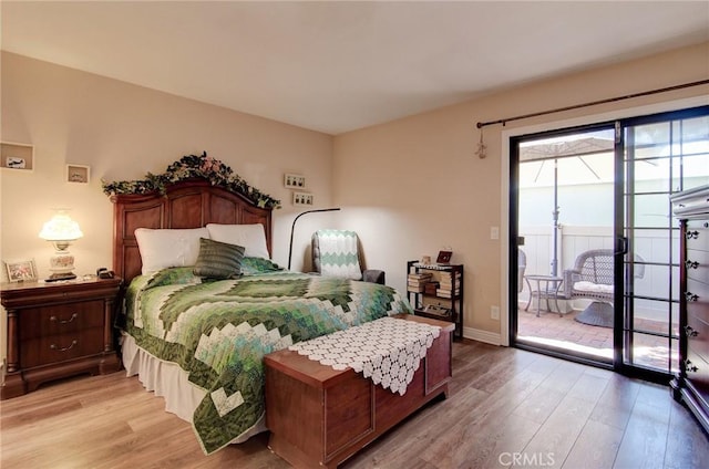8646 Butte Cir Unit 604B, Huntington Beach, CA 92646 - bedroom with light wood finished floors, access to exterior, and baseboards