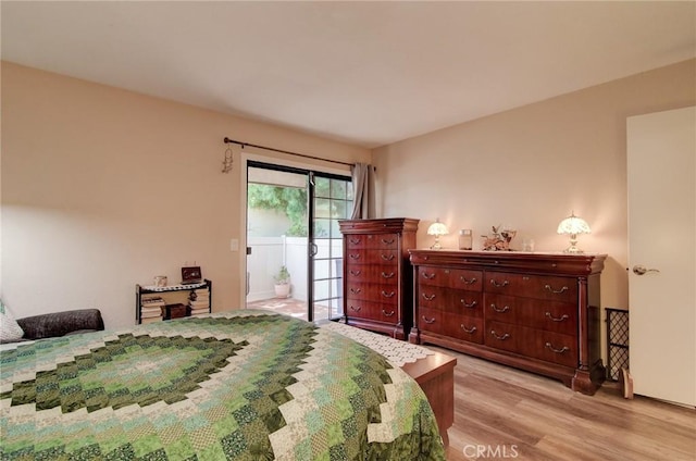 8646 Butte Cir Unit 604B, Huntington Beach, CA 92646 - bedroom featuring access to exterior and light wood-style floors