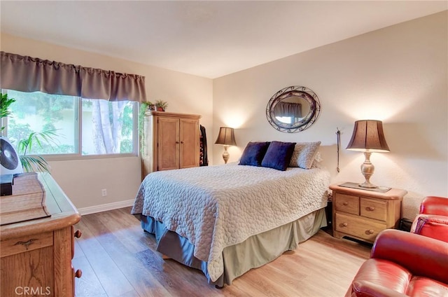 8646 Butte Cir Unit 604B, Huntington Beach, CA 92646 - bedroom with light wood-style floors and baseboards