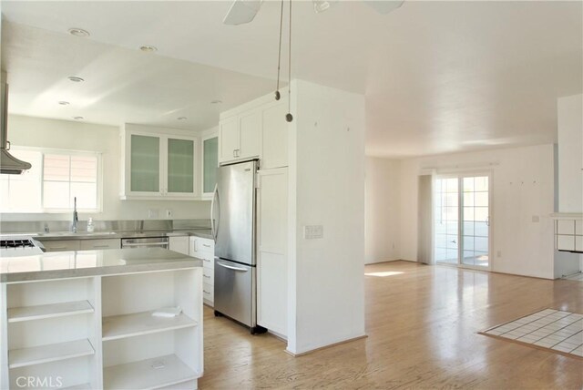 2800 Plaza Del Amo 190, Torrance, CA 90503 - kitchen featuring appliances with stainless steel finishes, a sink, healthy amount of natural light, and white cabinets
