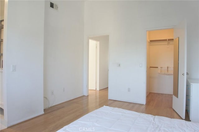 2800 Plaza Del Amo 190, Torrance, CA 90503 - bedroom with a walk in closet, wood finished floors, and a closet