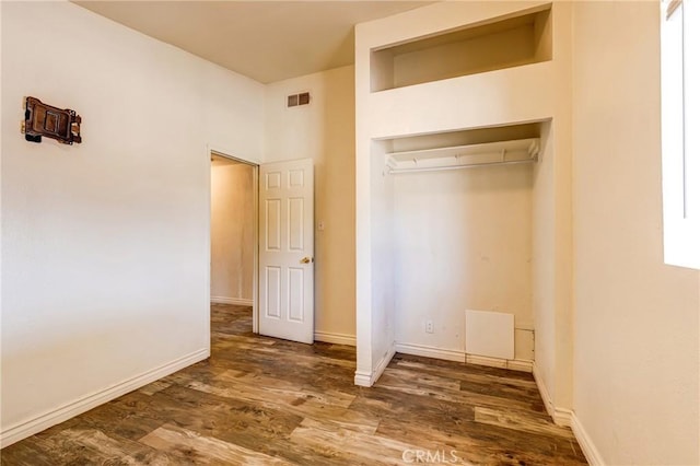 25189 Gentian Ave, Moreno Valley, CA 92551 - unfurnished bedroom with wood finished floors, baseboards, and a closet