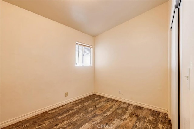 25189 Gentian Ave, Moreno Valley, CA 92551 - spare room with dark wood finished floors, baseboards, and vaulted ceiling