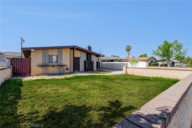 25189 Gentian Ave, Moreno Valley, CA 92551 - back of house with a chimney and stucco siding