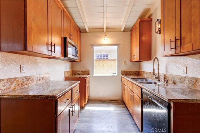 25189 Gentian Ave, Moreno Valley, CA 92551 - kitchen featuring black dishwasher, stainless steel microwave, a sink, light wood-style flooring, and brown cabinetry