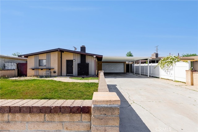 25189 Gentian Ave, Moreno Valley, CA 92551 - mid-century modern home with an attached carport, concrete driveway, a chimney, and a garage