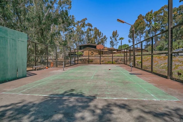 15390 Las Planideras, Rancho Santa Fe, CA 92067 - view of tennis court featuring community basketball court and fence