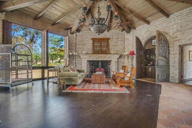 15390 Las Planideras, Rancho Santa Fe, CA 92067 - living area featuring high vaulted ceiling, beam ceiling, wooden ceiling, wood finished floors, and an outdoor brick fireplace