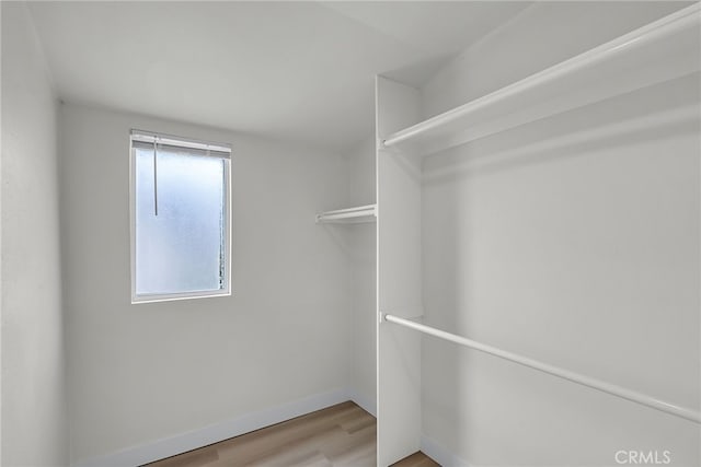 970 E 6th St, Pomona, CA 91766 - walk in closet with light wood-style floors