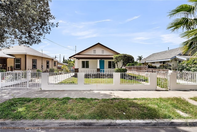 970 E 6th St, Pomona, CA 91766 - bungalow with a gate, a fenced front yard, a porch, and stucco siding