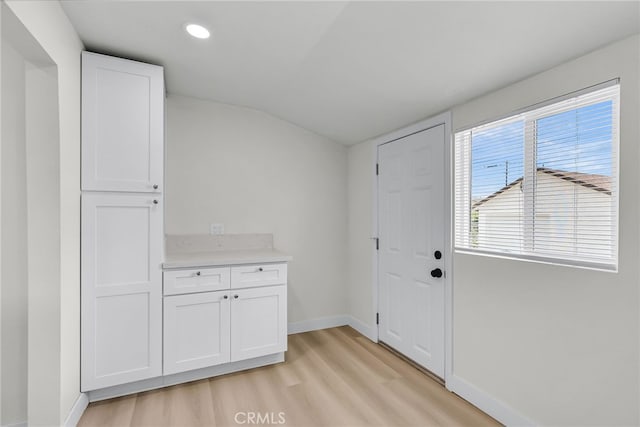 970 E 6th St, Pomona, CA 91766 - entrance foyer with light wood finished floors, baseboards, lofted ceiling, and recessed lighting