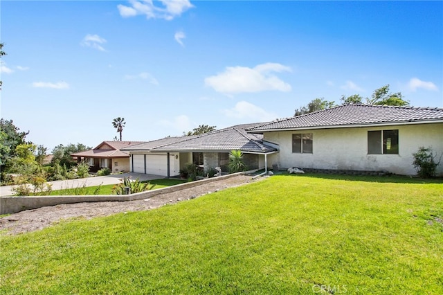 view of front facade featuring a garage, concrete driveway, stucco siding, and a front lawn
