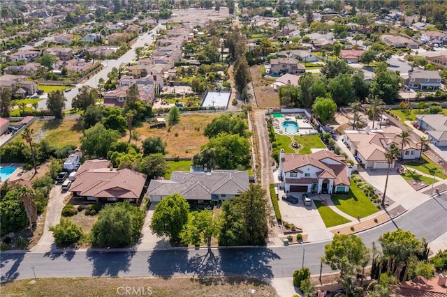 aerial view of residential area with a pool