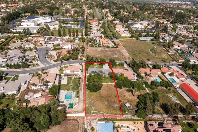 view of property location featuring property boundaries highlighted and nearby suburban area
