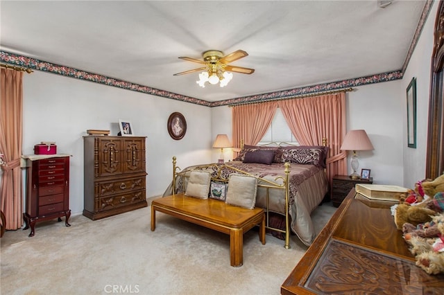 bedroom with carpet floors and a ceiling fan